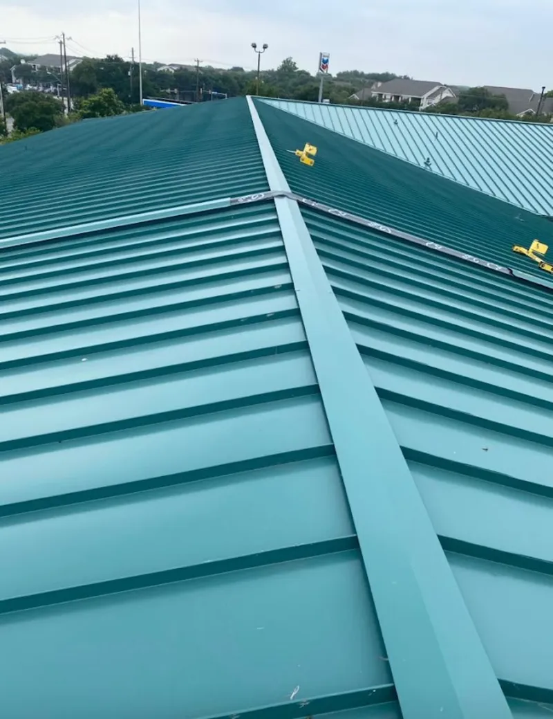 Green commercial metal roof ridge and valley for Metal Roof Repair in North Ridgeville